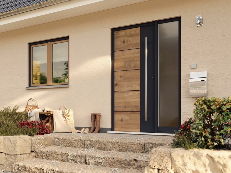 Genießen Sie die Detailansicht des Eingangsbereichs vom Flair 134 mit Steintreppen und Dachüberstand für einen einladenden ersten Eindruck.